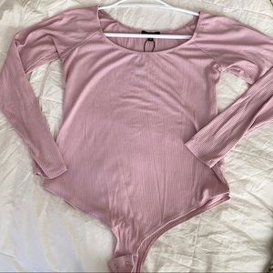 Pink bodysuit from Dynamite